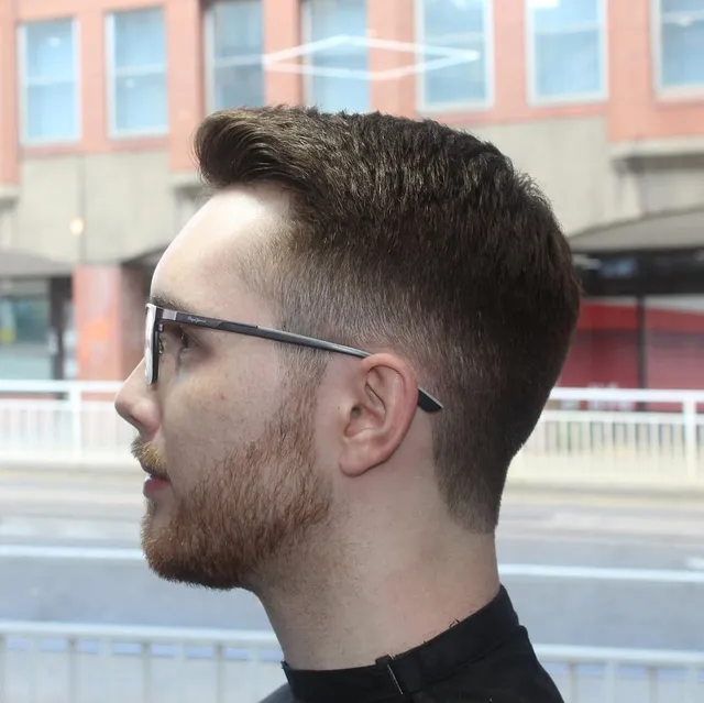 Textured quiff with a skin fade and beard