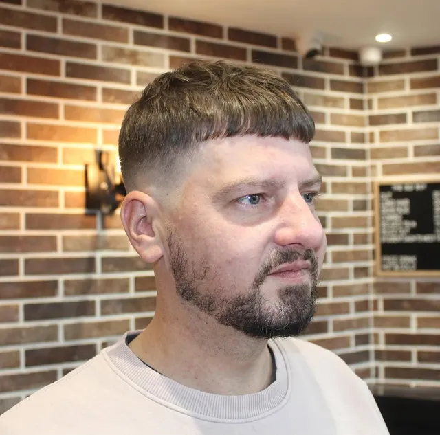 French crop with a faded beard