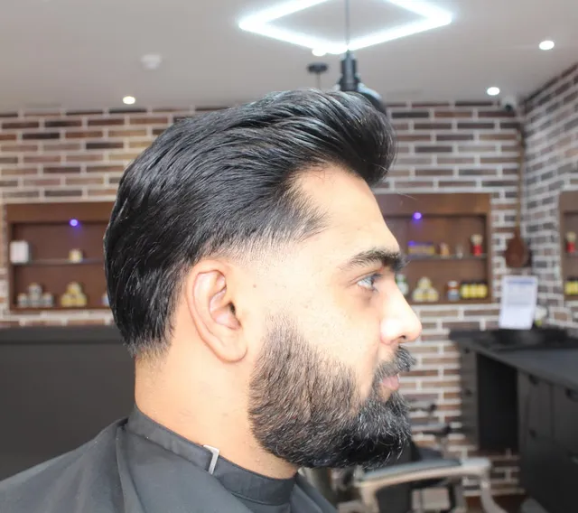 Pompadour and full beard, sharply blended