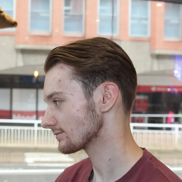 Slick back with a clean skin fade